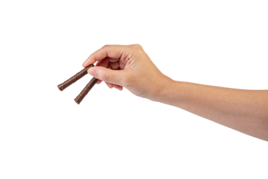 Chocolate bar in hand on transparent background