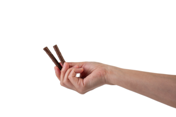 Chocolate bar in hand on transparent background