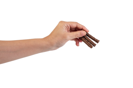 Chocolate bar in hand on transparent background
