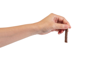 Chocolate bar in hand on transparent background