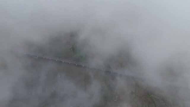 High-Speed Train Tracks in Foggy Karst Basin with Farmland