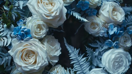 Elegant bouquet of white roses and blue ferns on a dark background