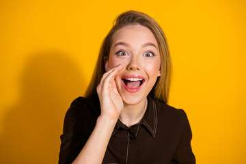 Young happy smiling woman with open mouth on bright yellow background fashion style portrait