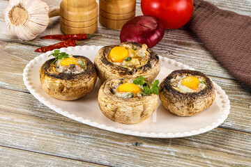 Baked champignon with quail egg