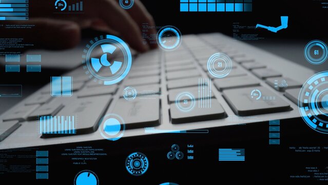 A close-up view of a keyboard with digital graphics in blue hues, showcasing technology and innovative concepts in a modern office environment. Perfect for tech-related imagery. Xenic