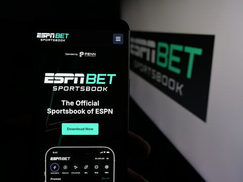 Stuttgart, Germany - 11-26-2025: Person holding smartphone with web page of US sportsbook company ESPN Bet on screen in front of logo. Focus on center of phone display.
