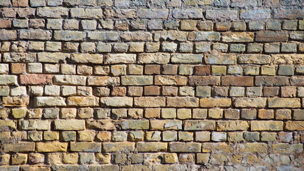 brown background, in the photo an old brick wall