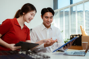 Businessmen team or financial data analysts working with tablets and laptop computers and data graphs together.