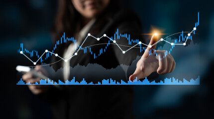A businesswoman interacts with a digital financial chart, analyzing data in a modern office. This image represents strategy, technology, and professional growth in the finance sector. Scalp