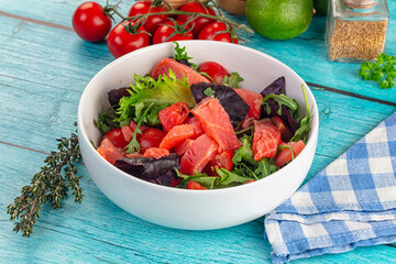 Salad with salmon and arugula