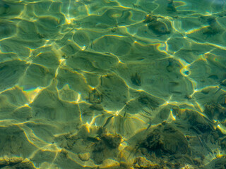Clear Aegean Sea water in the sun in Greece