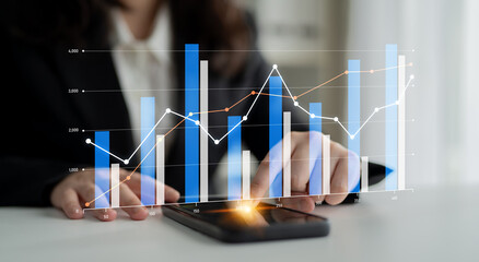 A business professional evaluates financial data on a smartphone while digital graphs illustrate trends and growth, showcasing a modern office environment and analytical skills. Scalp