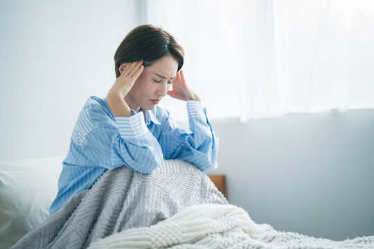 体調不良の女性