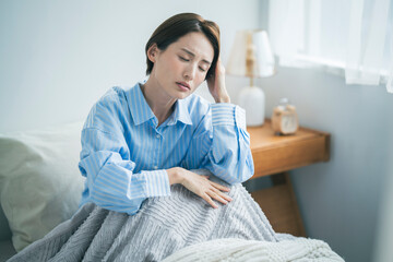 体調不良の女性