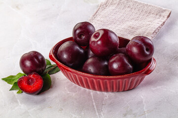 Raw ripe purple plum heap