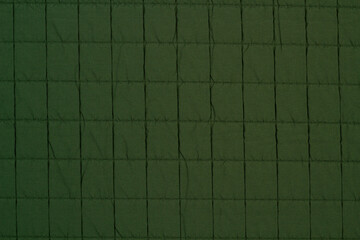 Fototapeta premium Quilted fabric. The texture of the blanket. Background to your project