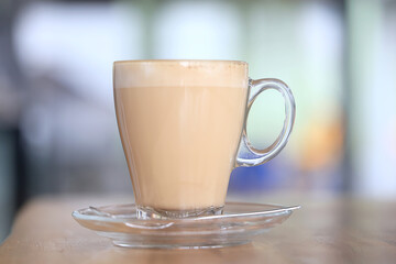 cappuccino, coffee in a clear glass cup in a cafe, soft color background food and drink, hot drink