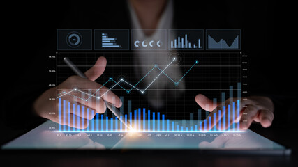 A business professional engages in detailed data analysis using a touchscreen interface, featuring vibrant graphs and charts to illustrate financial trends and growth. Scalp