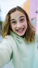 Playful Teenage Girl Grinning with Braces in Lifestyle Portrait