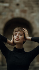 Editorial Portrait Model Framing Face Against Stone Archway