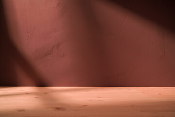 Table on brown background with natural shadows on the wall. Mock up for branding products, presentation, food and health care.	