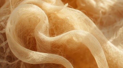 Soft peach-colored fabric with delicate texture and gentle folds