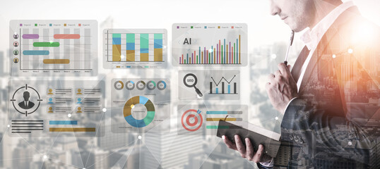 A business professional reviews data trends and metrics in a modern office, utilizing a digital...