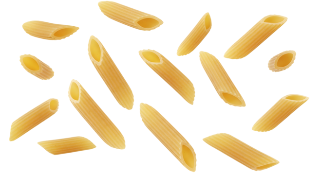 Penne pasta scattered against a black background