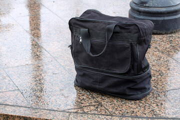 Abandoned black bag creating suspicious bomb threat