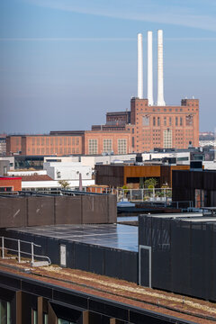 Industrial skyline and clean lines above an urban waterfront in Copenhagen combine industry and energy infrastructure with environment, sustainability narratives and broader climate action