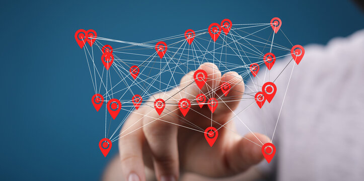Hand interacting with a digital network map.  Concept of global connections, communication, and technology.