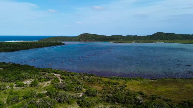 Kosi Bay Mouth with Traditional Thonga or Tsonga Fish Traps, camera panning left to right over the sea towards the land. 4K Aerial Video.