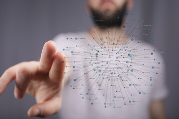 Close up of a man's finger interacting with a network diagram representing a digital concept like data visualization and technology. Great for b
