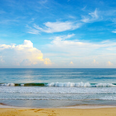 Bright morning landscape of blue sky with white clouds and ocean coast.