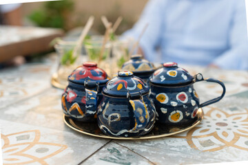 set of colourful Egyptian tea cups together with tea glasses