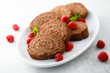Dark chocolate swiss roll with raspberry