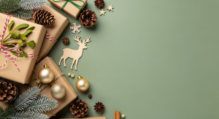 Festive christmas gifts with pine cones, mistletoe, golden baubles, and wooden reindeer on green winter holiday background