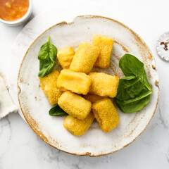 Fish nuggets with fresh spinach
