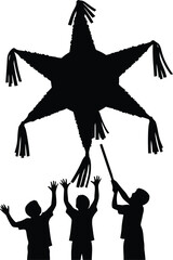 Silhouette of children reaching for a star shaped piñata