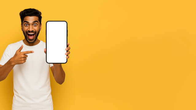 Excited person showing a blank smartphone screen