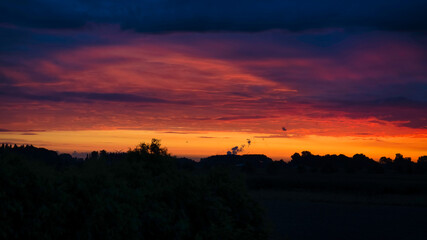 Rural silhouettes with a spectacular sunset as background