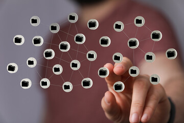 Hand interacting with digital network of file folders, representing data storage, cloud computing, and cybersec