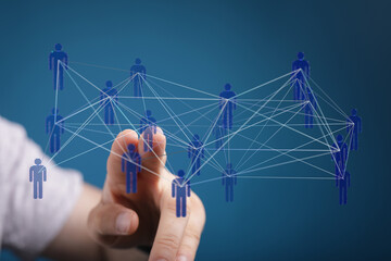 Hand touching a network of people, representing connection, communication, social media, teamwork, and global r