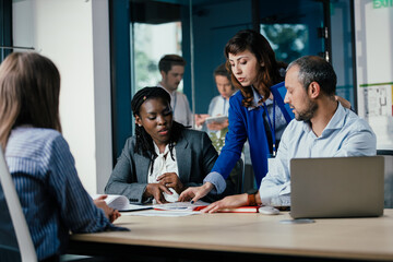Black Female Manager Leading Feedback Session as Student Intern Joins Team