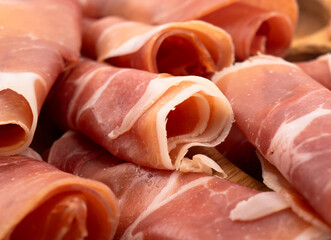 Jamon serrano. A Spanish ham texture background. Traditional spanish jamon sliced. Dry cured meat ham hamon iberico