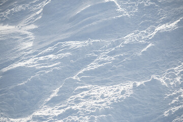 Abstract textured background of rough white snow surface