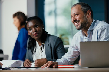 Diverse Business Colleagues Discussing Project in Modern Open Plan Office