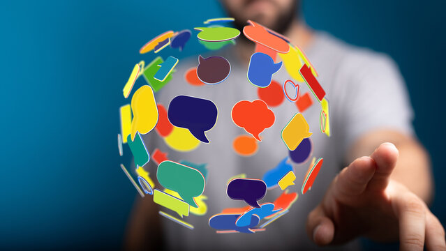 Man interacting with a digital sphere of communication icons. Social media engagement, global communication and online discussion concepts.