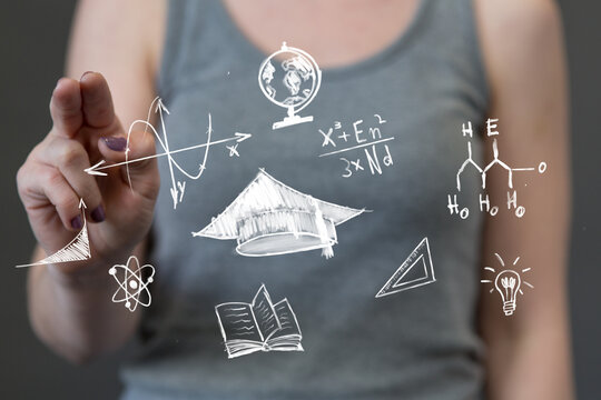 Modern learning concept: A hand touches a transparent screen filled with scientific and academic doodles, symbolizing innovation in education an - Powered by Adobe