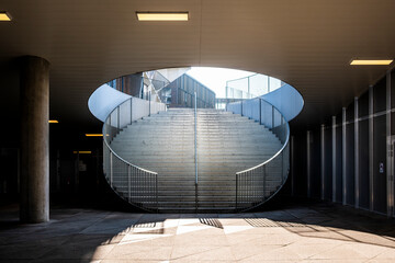 A concise architecture perspective showing a staircase moving through geometry in a compact structure complemented by urban metal detail adding modern symmetry shaped by minimal design